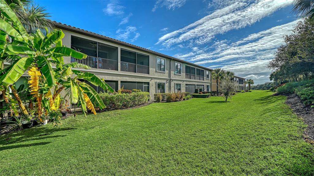 13604 Messina Loop, Unit 103 Bradenton, FL 34211 - Photo 32 of 97 a front view of a house with a garden