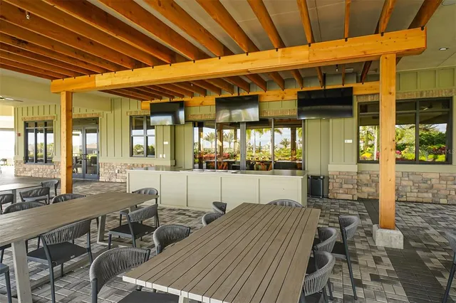 a view of a golf course with chairs
