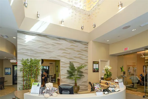 an aerial view of residential house with outdoor space and a lake view