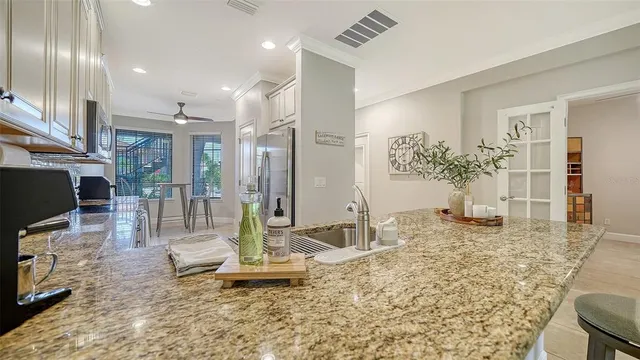 a kitchen with stainless steel appliances a refrigerator and a stove top oven