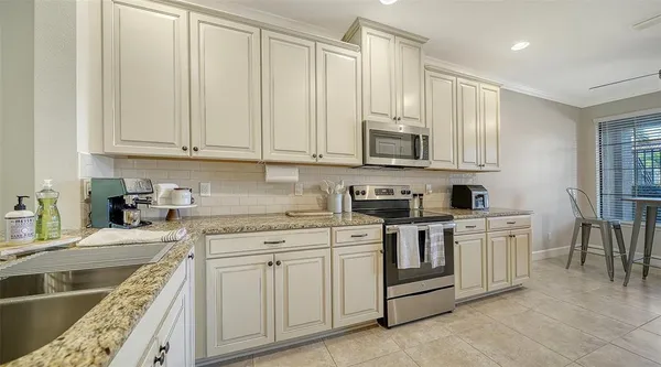 a very nice looking dining room with a large window