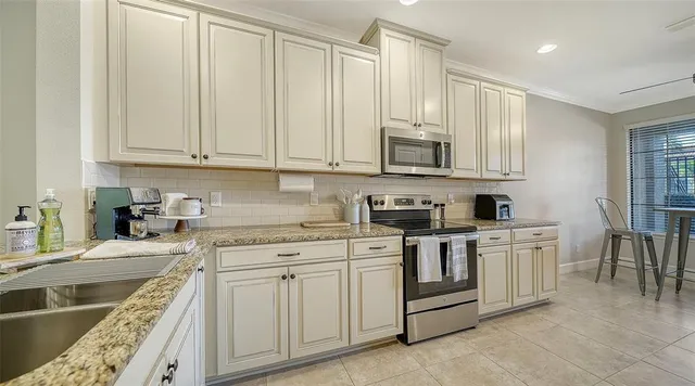 a very nice looking dining room with a large window