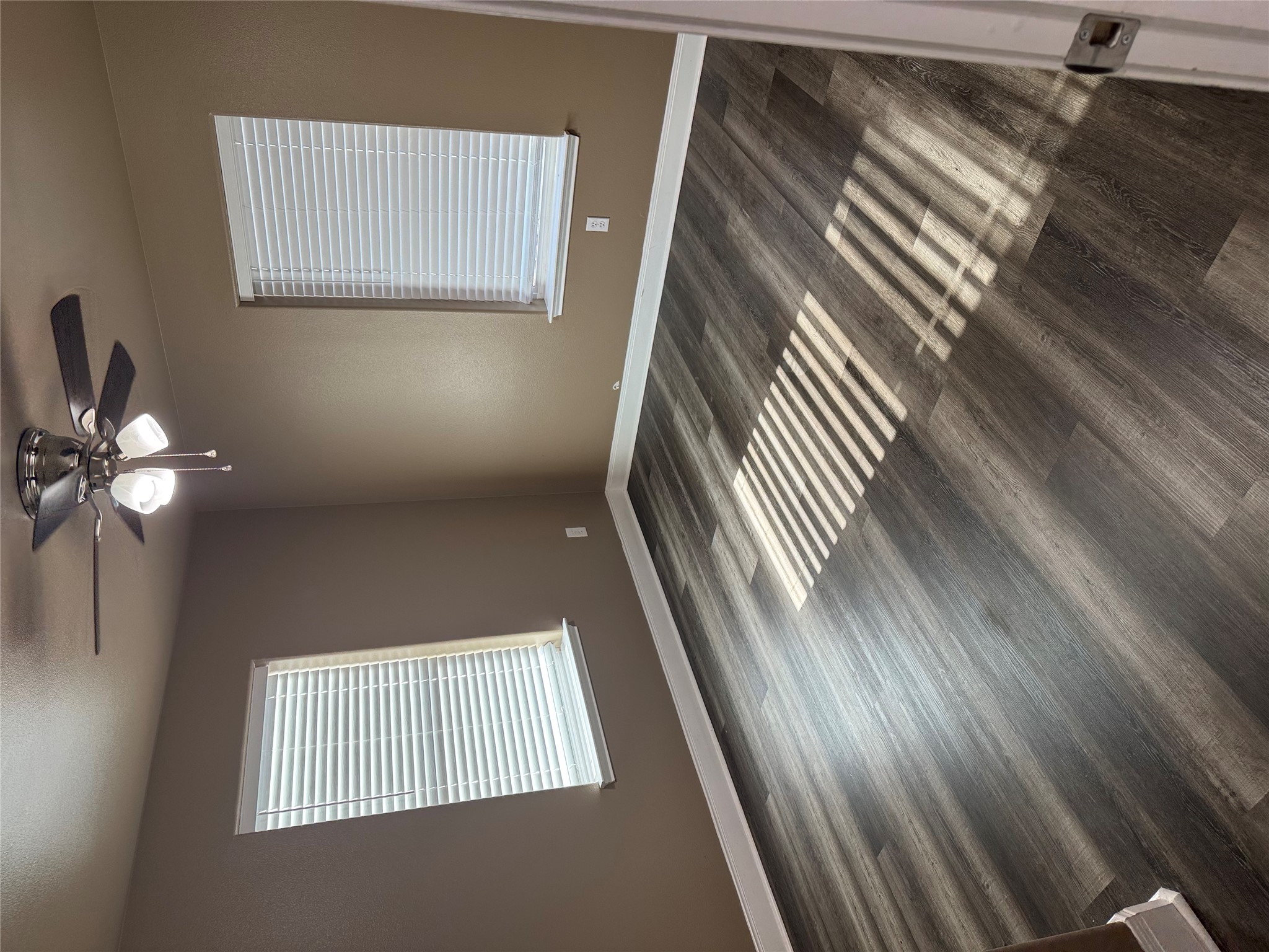 5706 Melody Lane, Unit 2 Austin, TX 78724 - Photo 8 of 13 a view of an empty room with wooden floor and a window
