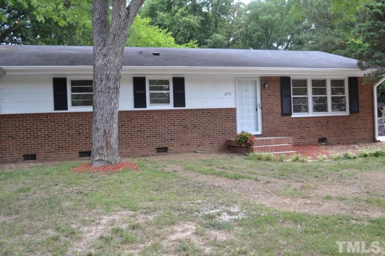 2709 Ramsey Road Raleigh, NC 27604 - Photo 1 of 6 a front view of a house with garden