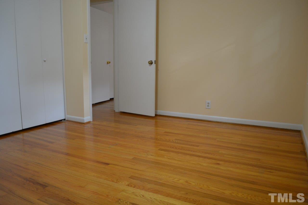 2709 Ramsey Road Raleigh, NC 27604 - Photo 4 of 6 a view of an empty room with wooden floor