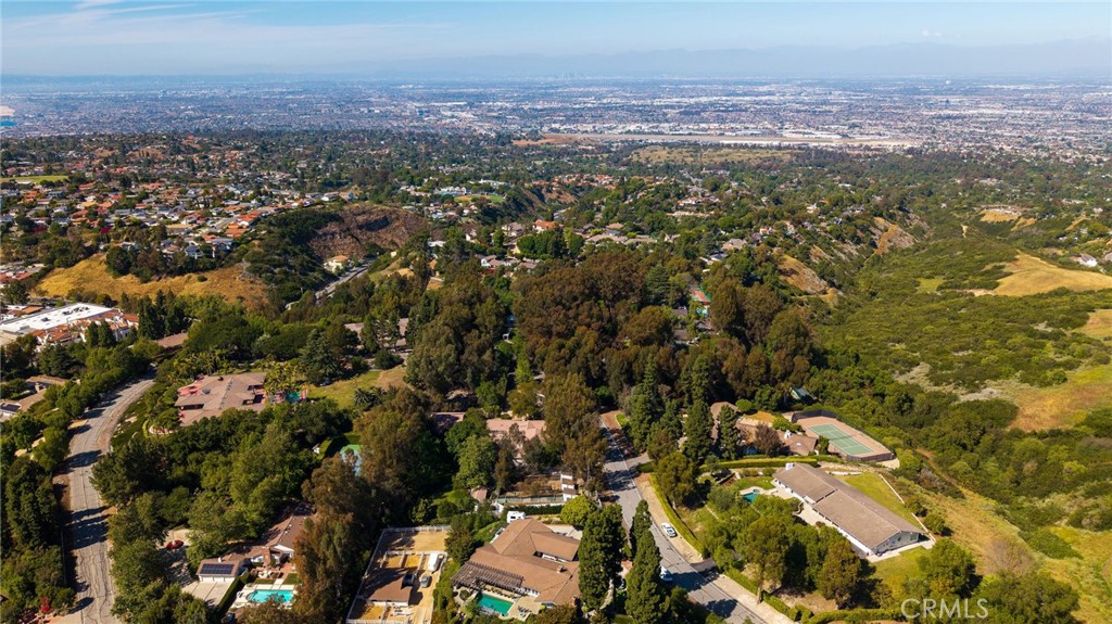 14 Johns Canyon Road Rolling Hills, CA 90274 - Photo 4 of 45 an aerial view of residential house with yard and mountain view in back