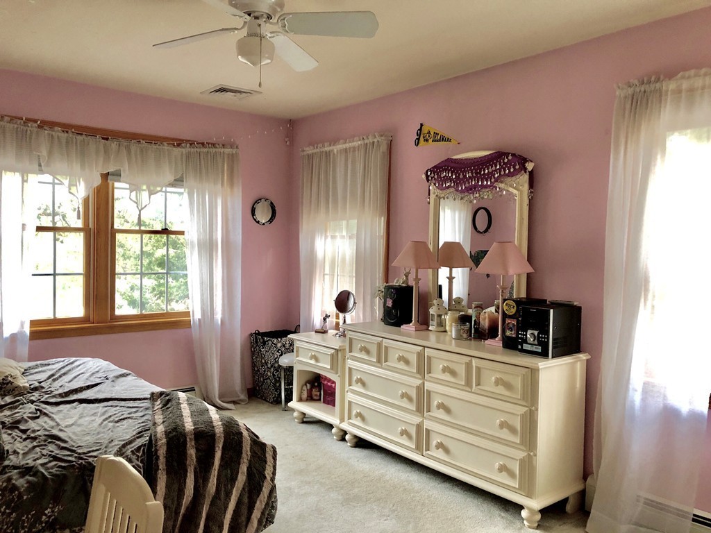 11 Hampton Road Sharon, MA 02067 - Photo 18 of 27 a bed room with a bed and a dresser
