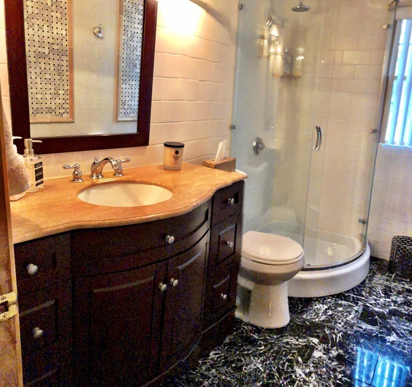 11 Hampton Road Sharon, MA 02067 - Photo 4 of 27 a bathroom with a sink a toilet and shower