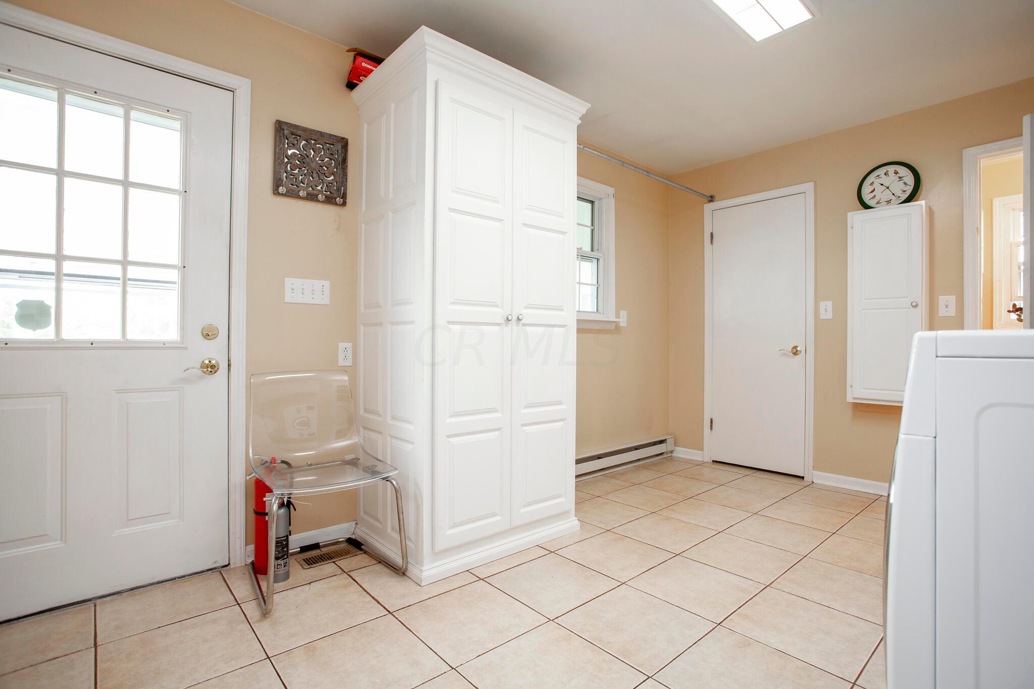 4979 Nickelson Road Prospect, OH 43342 - Photo 51 of 68 Mudroom/Laundry room is huge and bright.