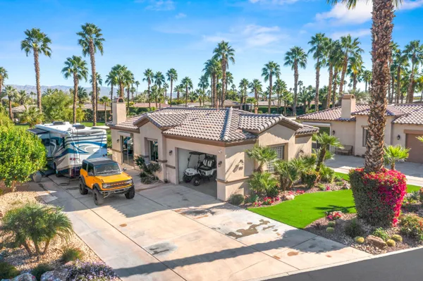 an aerial view of a house with a garden