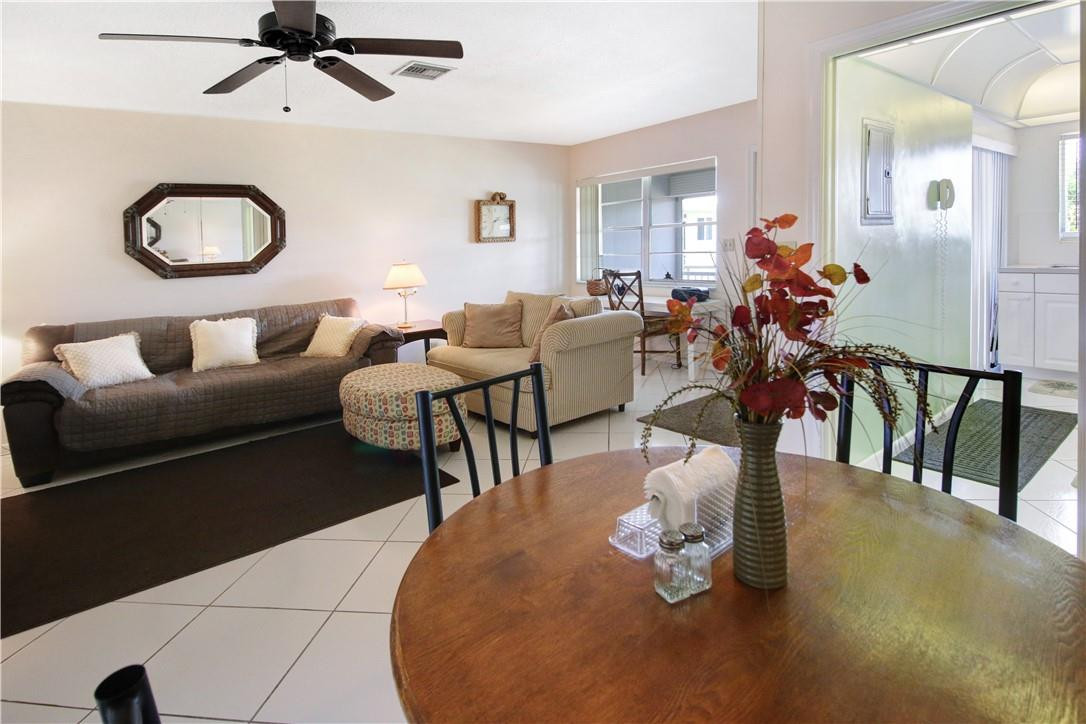2100 Northeast 38th Street, Unit 222 Lighthouse Point, FL 33064 - Photo 11 of 21 a living room filled with furniture