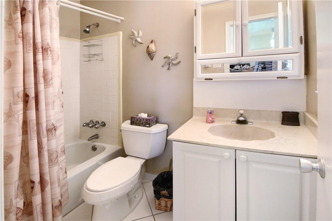 2100 Northeast 38th Street, Unit 222 Lighthouse Point, FL 33064 - Photo 19 of 21 a bathroom with a sink and a mirror