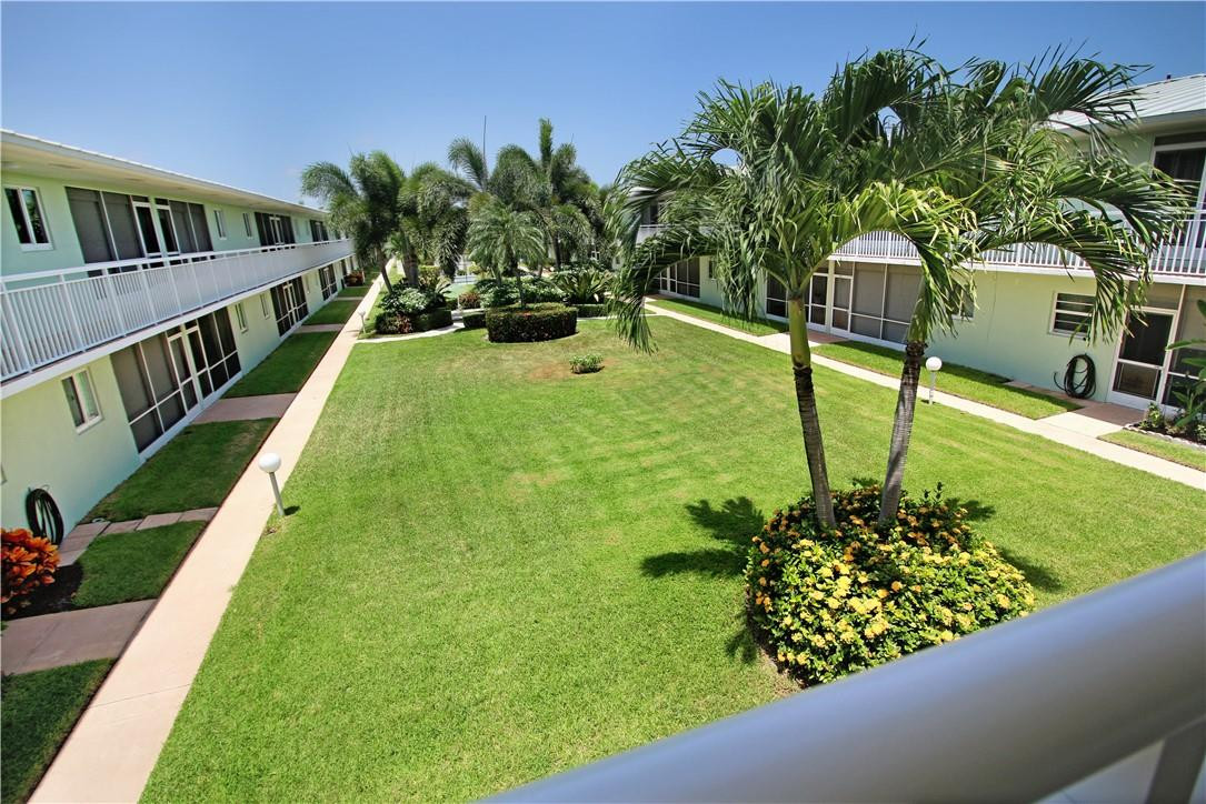 2100 Northeast 38th Street, Unit 222 Lighthouse Point, FL 33064 - Photo 20 of 21 a view of a garden with an outdoor seating
