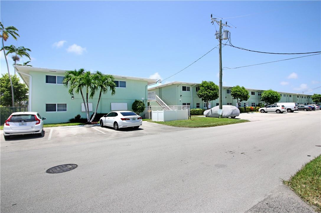 2100 Northeast 38th Street, Unit 222 Lighthouse Point, FL 33064 - Photo 21 of 21 a car parked on the side of the road