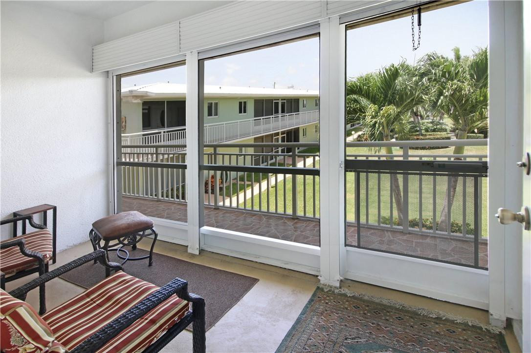 2100 Northeast 38th Street, Unit 222 Lighthouse Point, FL 33064 - Photo 4 of 21 a living room filled with furniture