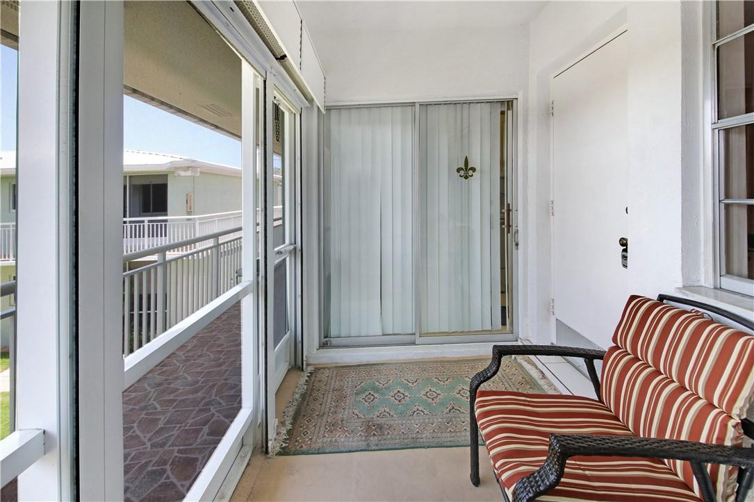 2100 Northeast 38th Street, Unit 222 Lighthouse Point, FL 33064 - Photo 5 of 21 a view of livingroom with furniture and floor to ceiling window