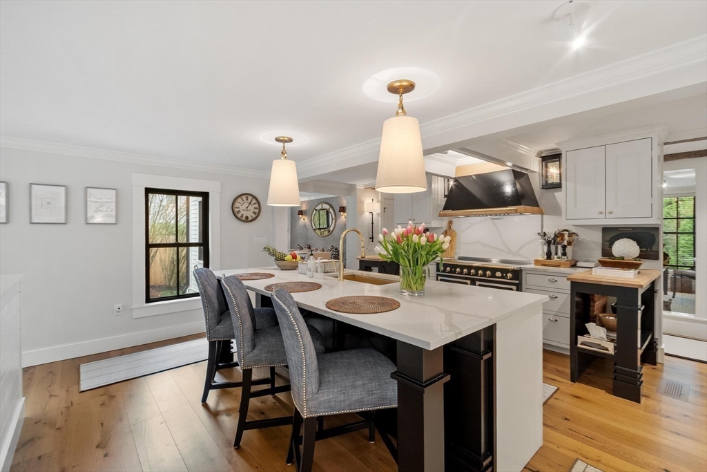 653 Main Street Concord, MA 01742 - Photo 10 of 42 a view of a dining room with furniture and wooden floor