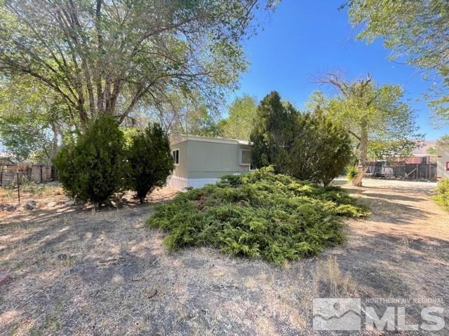 3625 Hummingbird Drive Reno, NV 89508 - Photo 17 of 18 a view of a yard with plants and trees