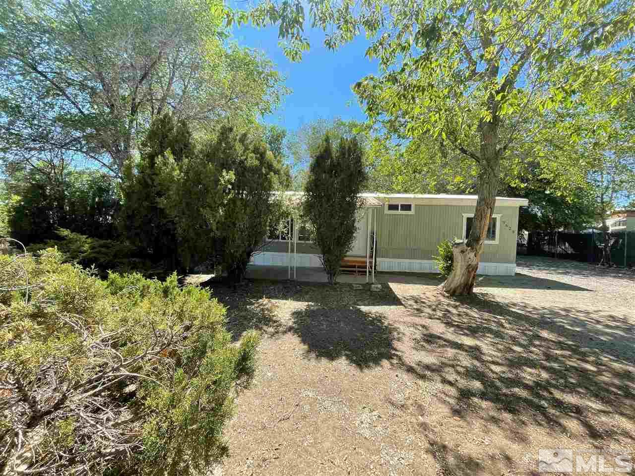 3625 Hummingbird Drive Reno, NV 89508 - Photo 18 of 18 a view of a backyard with trees