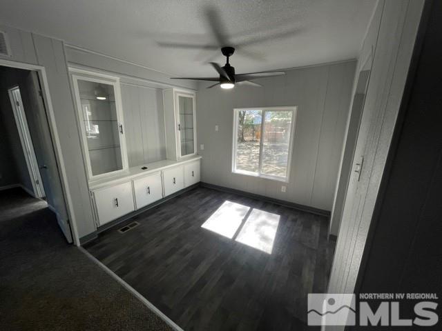 3625 Hummingbird Drive Reno, NV 89508 - Photo 3 of 18 a view of an empty room with wooden floor and a window