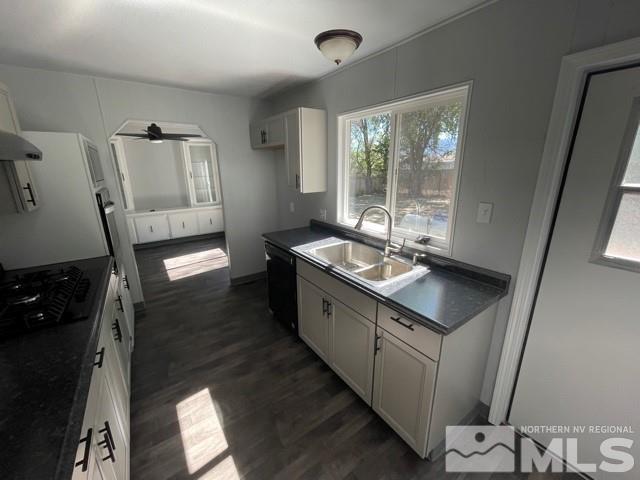 3625 Hummingbird Drive Reno, NV 89508 - Photo 4 of 18 a kitchen with sink cabinets and wooden floor