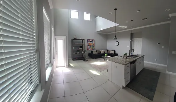 a kitchen with a sink and cabinets