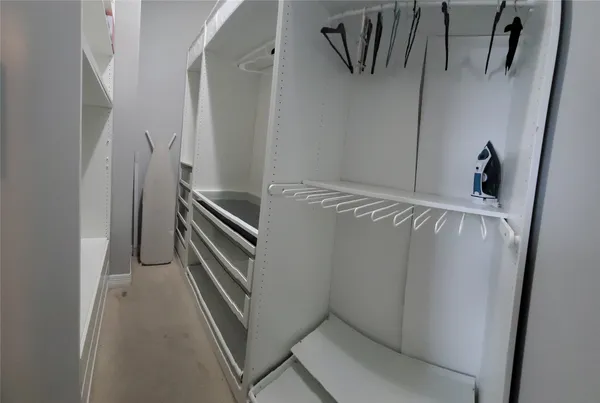 a bathroom with a tub shower and mirror