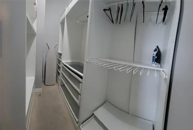 a bathroom with a tub shower and mirror