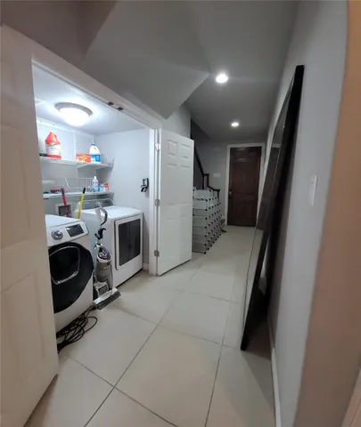 a view of a storage & utility room with washer and dryer