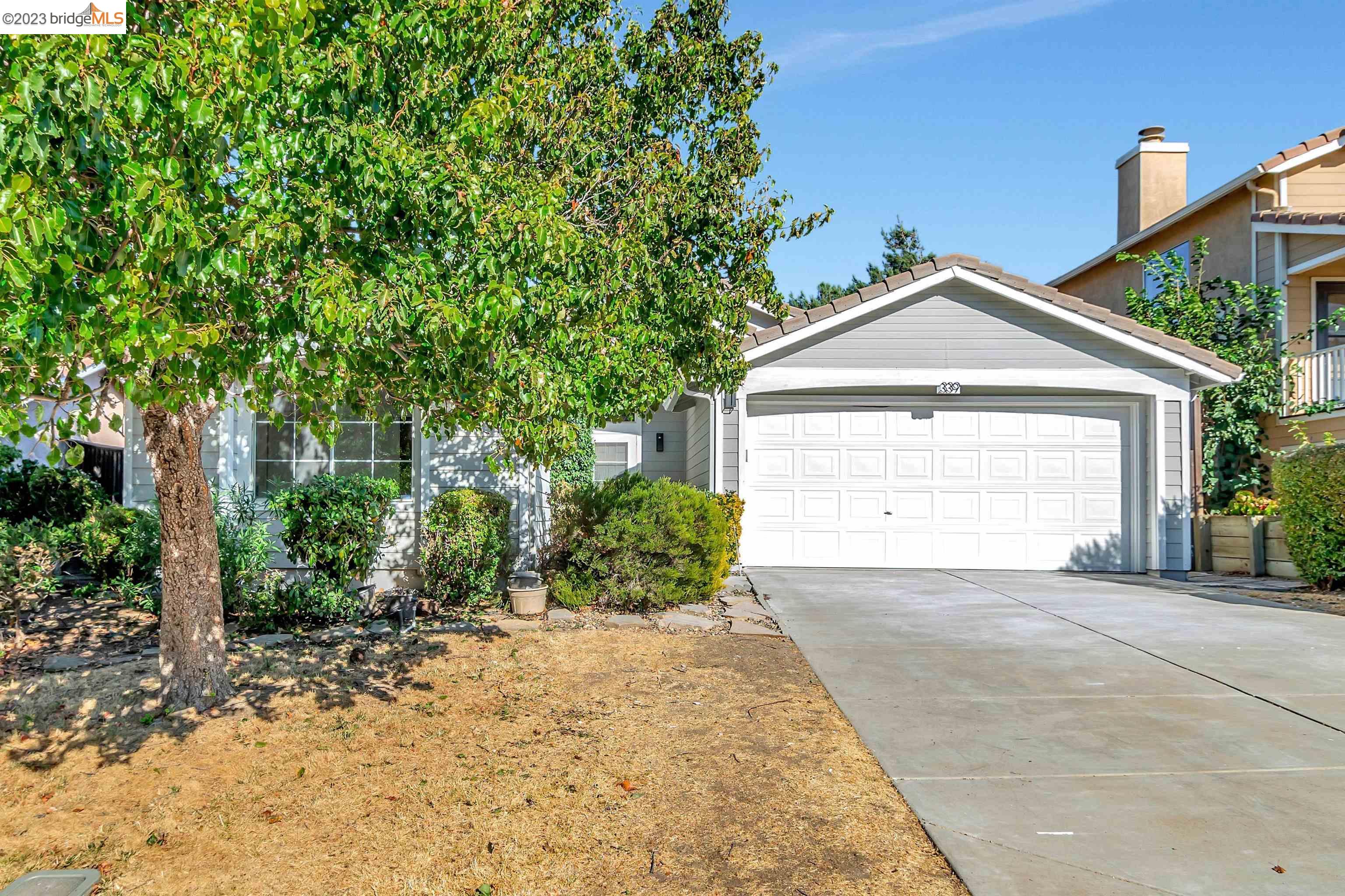 339 Powell Drive Bay Point, CA 94565 - Photo 1 of 1 a front view of a house with a yard and garage