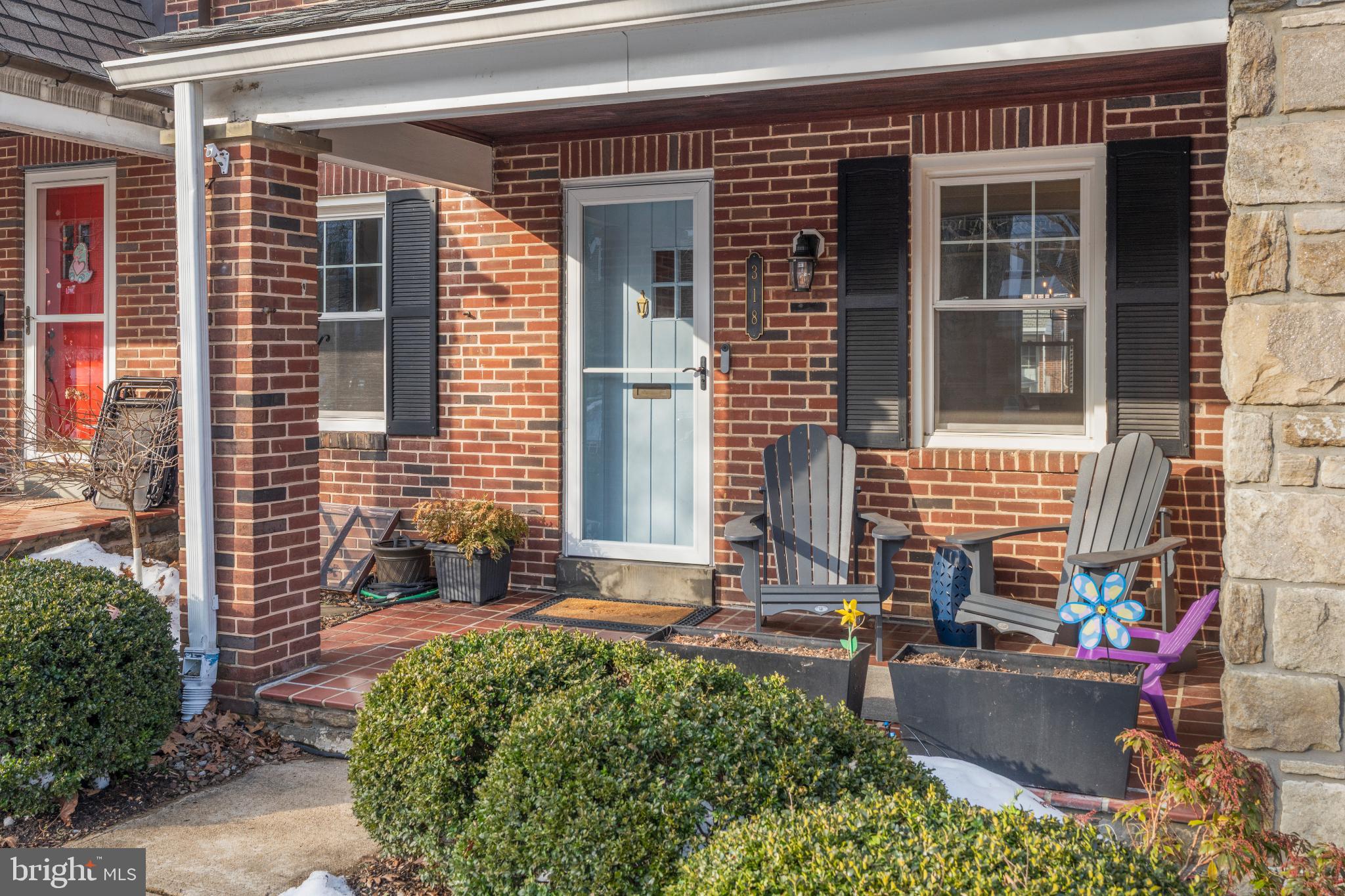 318 Hopkins Road Baltimore, MD 21212 - Photo 32 of 37 Charming brick entryway with inviting seating.