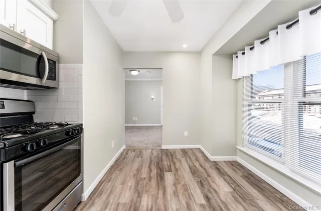 a view of a kitchen from a ceiling fan