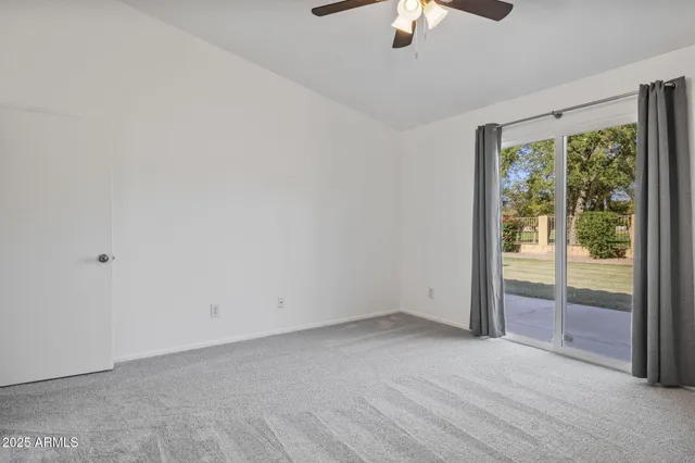 a view of workspace and a window in a room