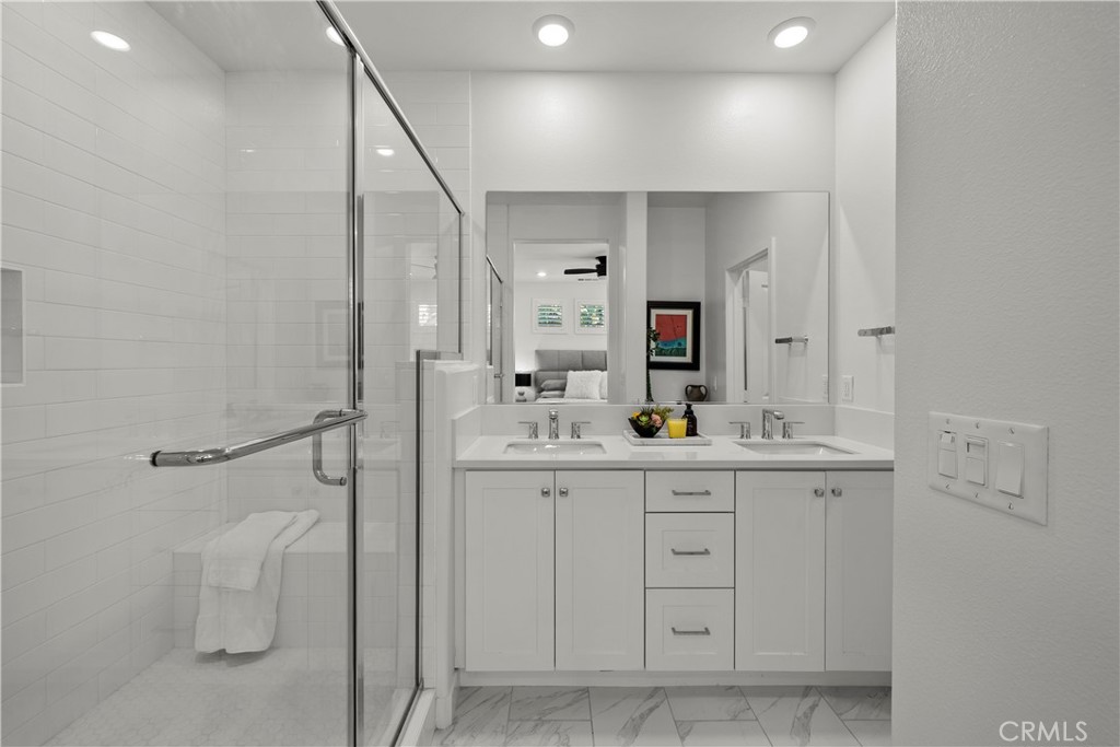 1663 Rosewell Road West Covina, CA 91791 - Photo 21 of 45 a spacious bathroom with a double vanity sink and a mirror