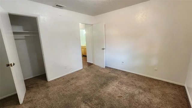 a bathroom with a granite countertop toilet a sink and a bathtub