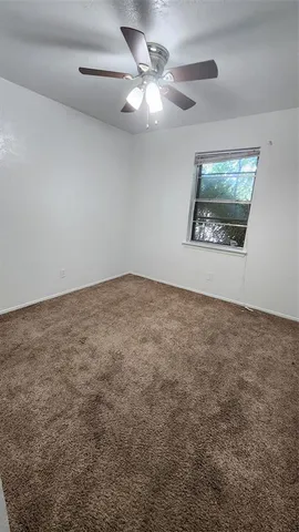 an empty room with a bathroom