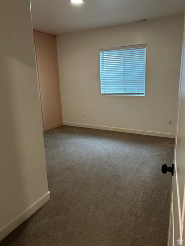 315 South Sherman Street Mapleton, UT 84664 - Photo 15 of 30 Carpeted room featuring a window with blinds, recessed lighting, and a built-in vertical cabinet