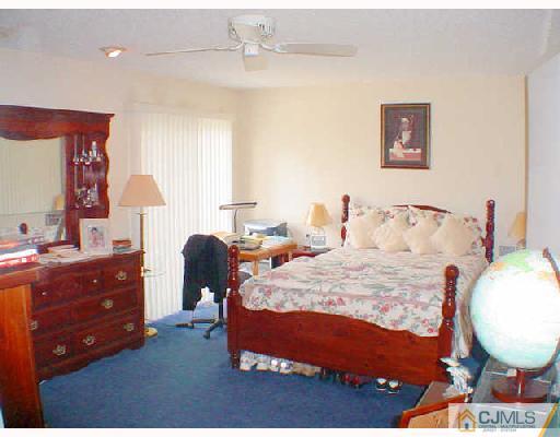 6201 Hana Road Edison, NJ 08817 - Photo 5 of 8 a bedroom with bed and a window