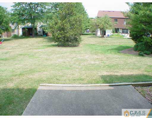 6201 Hana Road Edison, NJ 08817 - Photo 8 of 8 a view of a yard with an trees