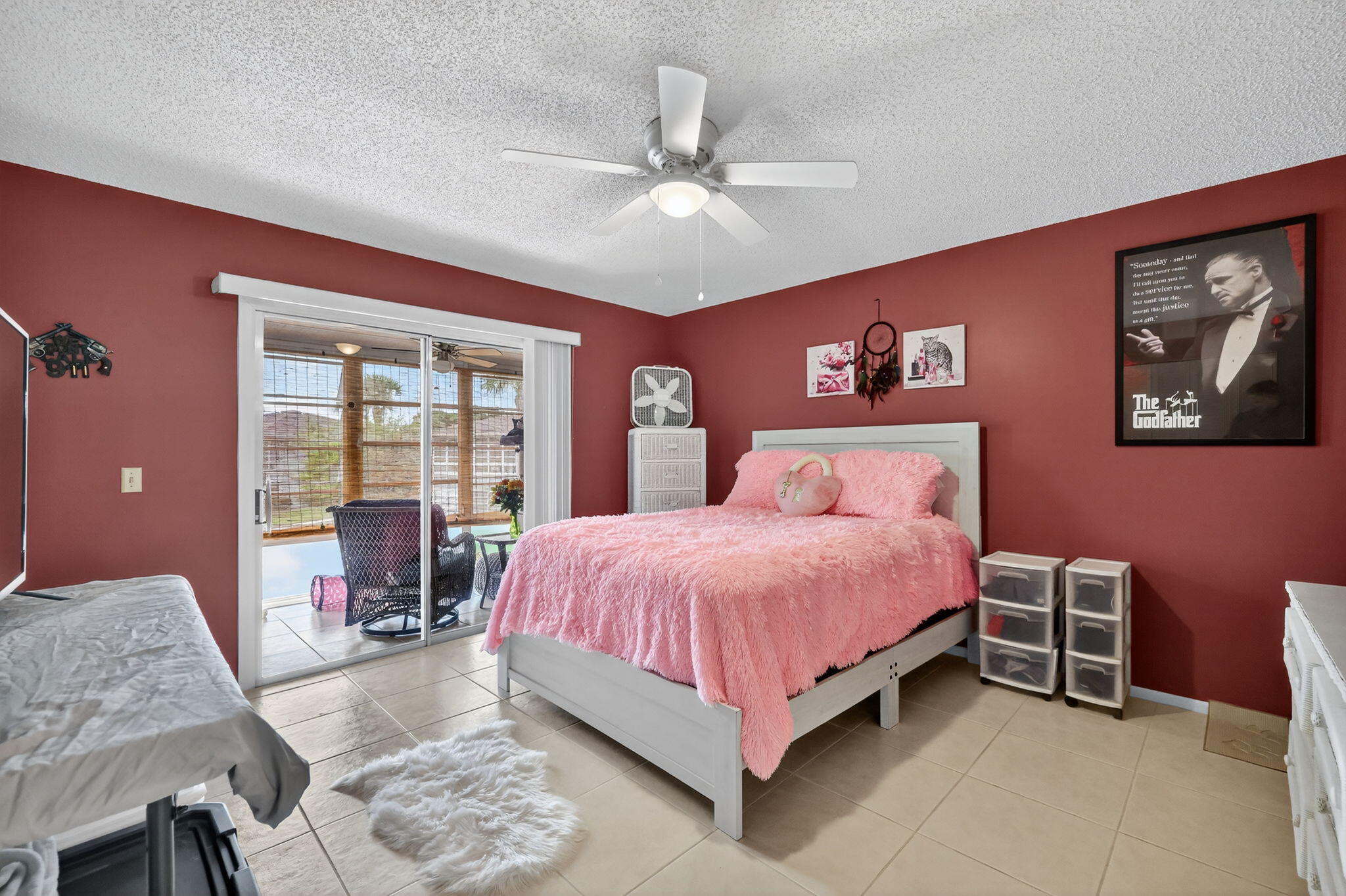 23 Lake Vista Trail, Unit 204 Port St. Lucie, FL 34952 - Photo 16 of 35 a spacious bedroom with a bed and wooden floor