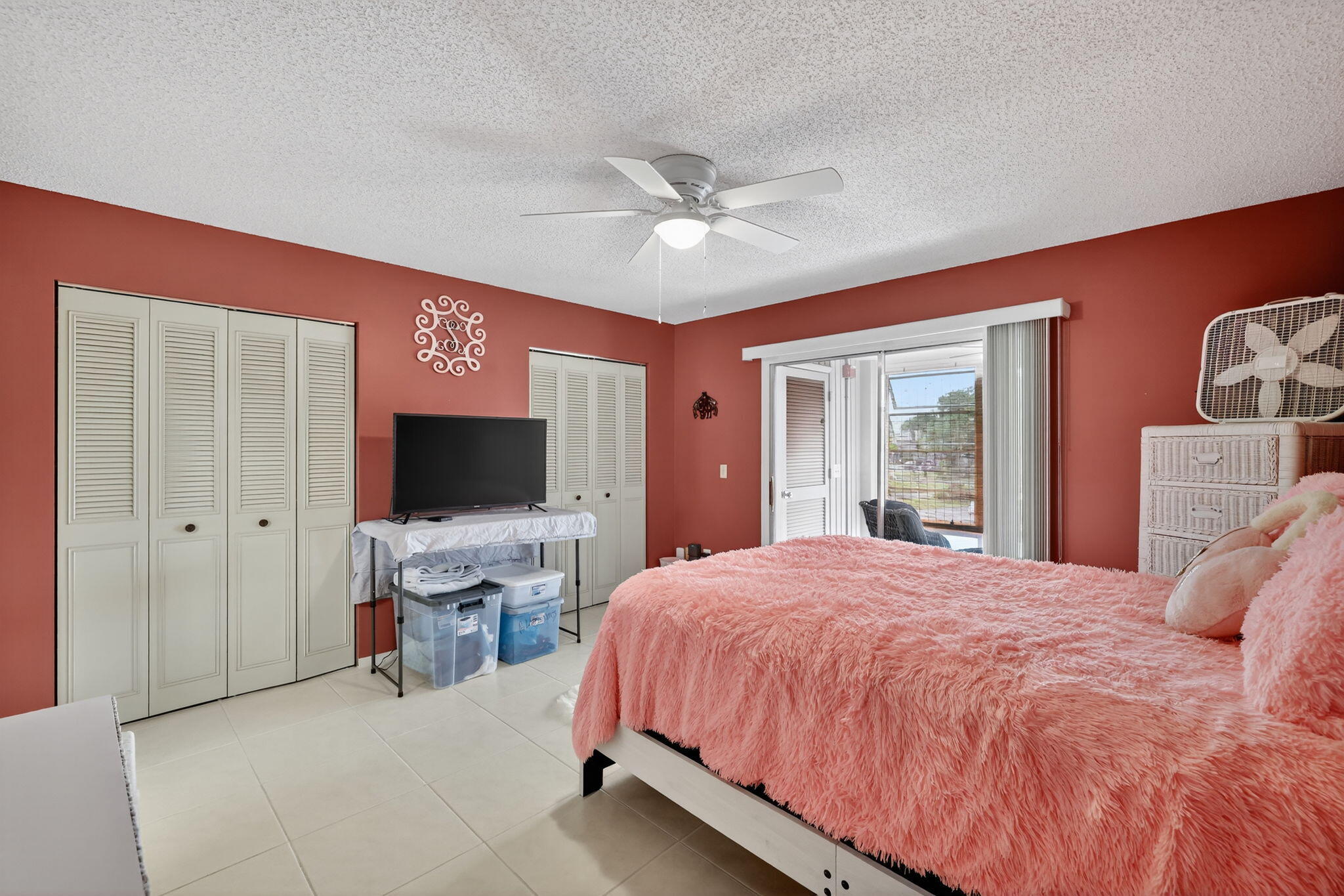 23 Lake Vista Trail, Unit 204 Port St. Lucie, FL 34952 - Photo 18 of 35 a bedroom with a bed and a flat screen tv