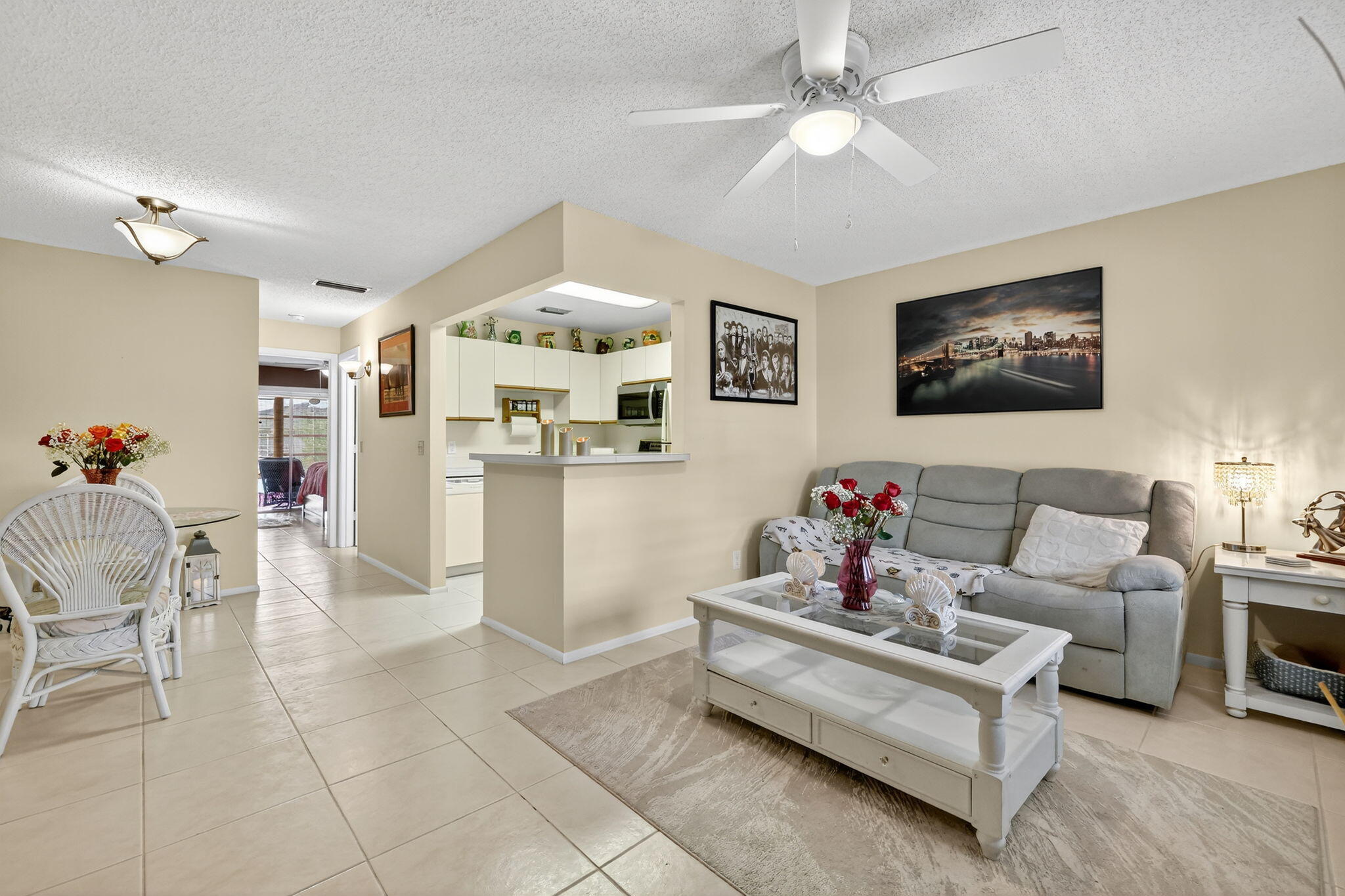 23 Lake Vista Trail, Unit 204 Port St. Lucie, FL 34952 - Photo 8 of 35 a living room with furniture and kitchen view