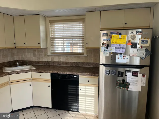 a kitchen with stainless steel appliances cabinets and a counter top space
