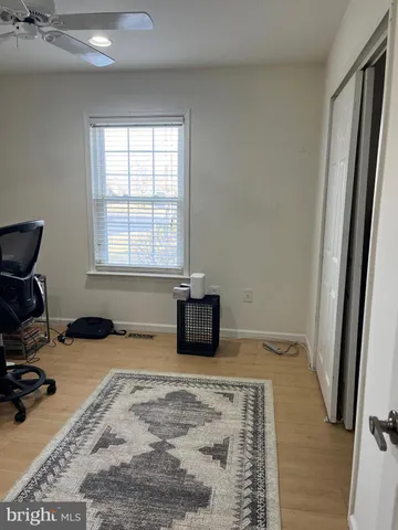 a room with a bed furniture and a window