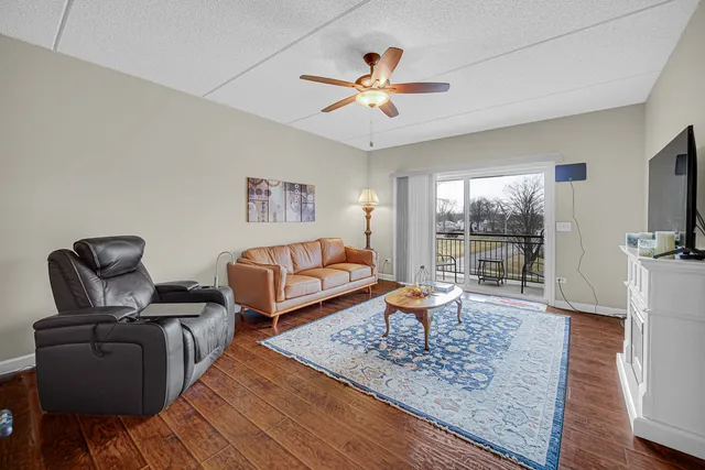 a bathroom with a sink a toilet a light fixture and a mirror