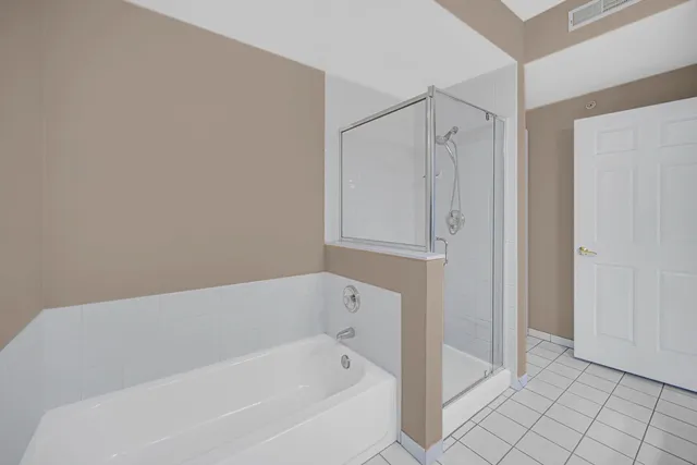 a view of a two chairs and table in the balcony