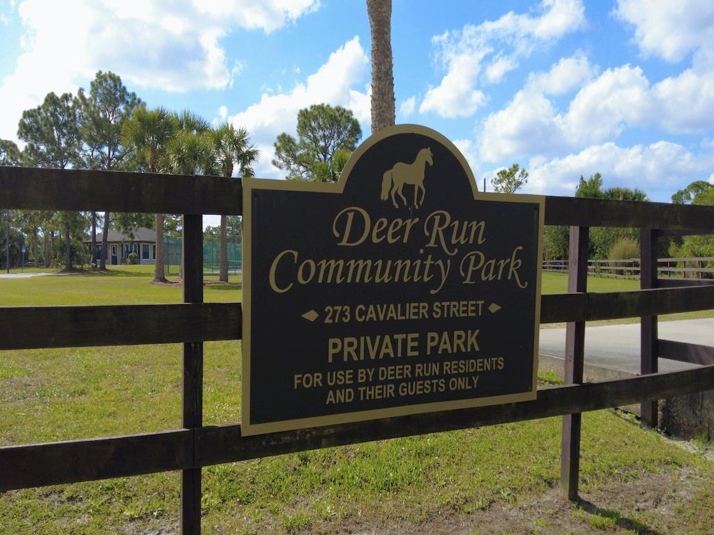 212 Deer Run Road Palm Bay, FL 32909 - Photo 11 of 15 a view of a park with wooden fence