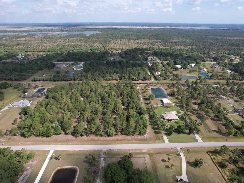 212 Deer Run Road Palm Bay, FL 32909 - Photo 7 of 15 an aerial view of residential houses with outdoor space