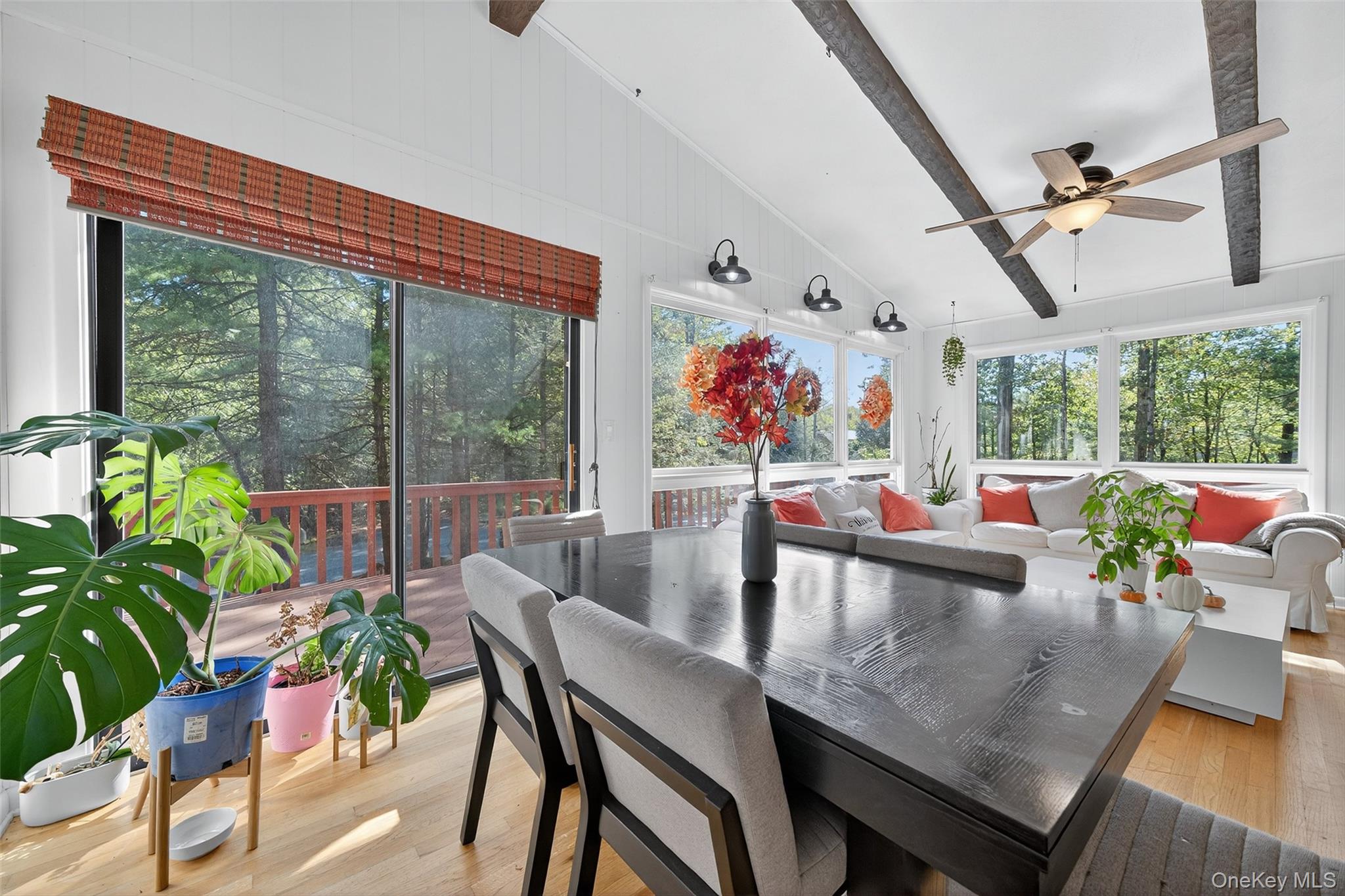 75 Pebble Path Rock Hill, NY 12775 - Photo 13 of 39 a view of a dining room with furniture large windows and wooden floor
