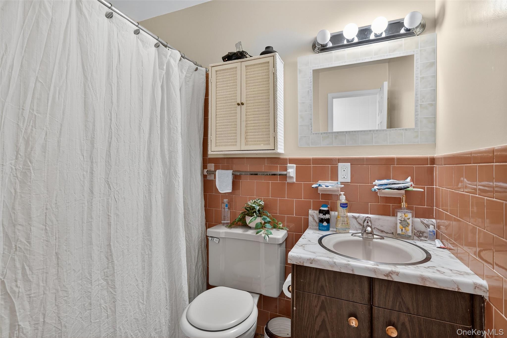 75 Pebble Path Rock Hill, NY 12775 - Photo 23 of 39 a bathroom with a sink vanity mirror and toilet